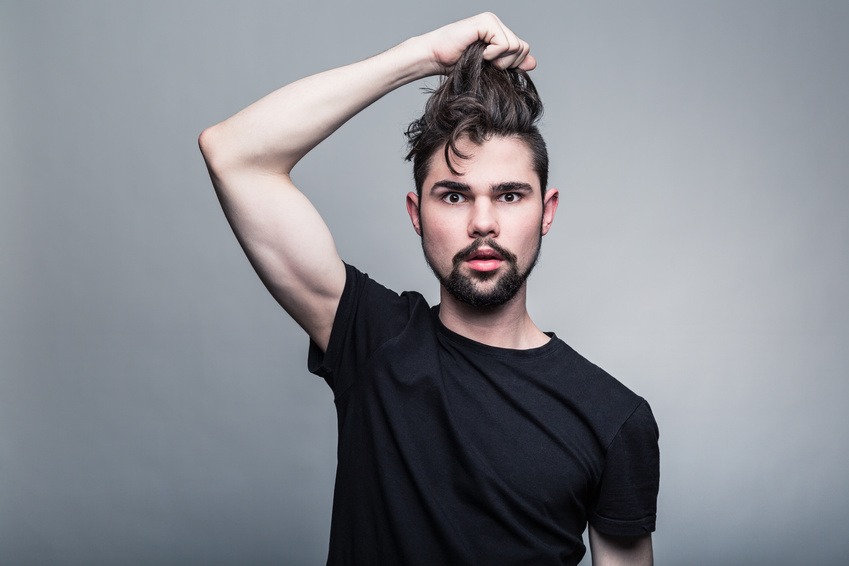 man in black tshirt pulling hair